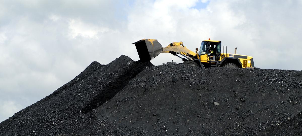 A front end loader working with coal