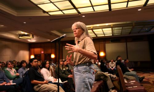 Scientist speaking at town hall meeting