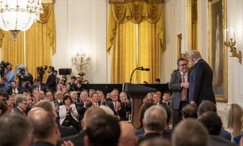 President Donald Trump shaking hands with Andrew Wheeler.