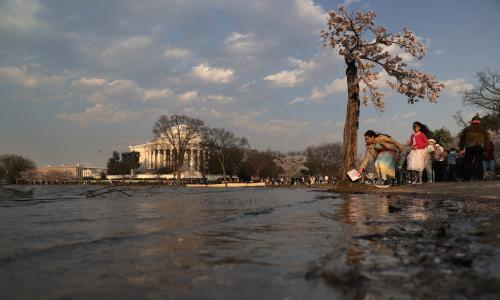 People near a flooded Capitol building.